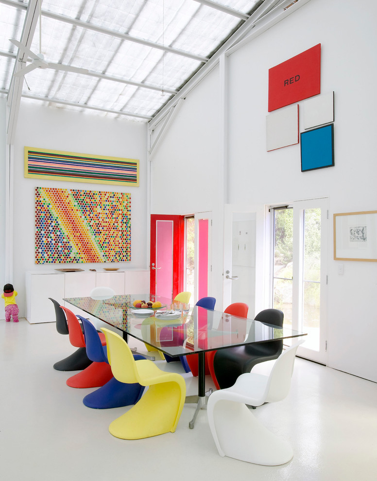Inspiration for a large industrial dining room remodel in Melbourne with white walls