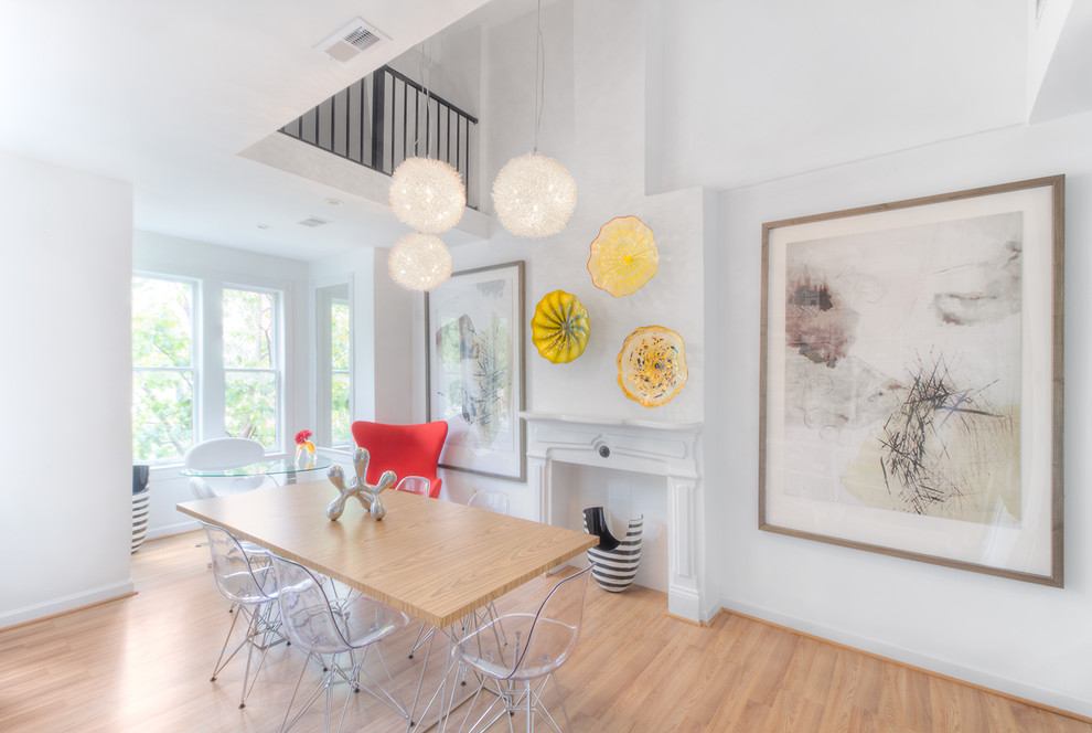 Minimalist light wood floor dining room photo in DC Metro with white walls