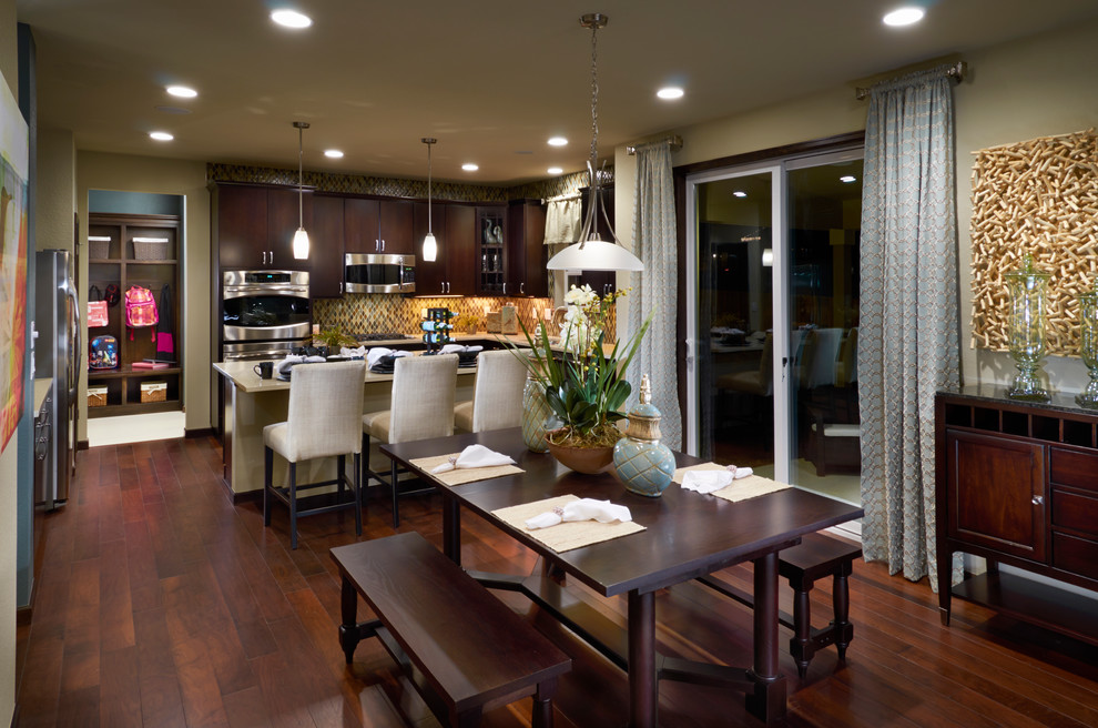 Inspiration for a large timeless dark wood floor and brown floor kitchen/dining room combo remodel in Denver with green walls and no fireplace