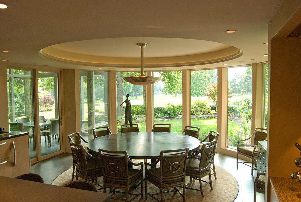 This is an example of a contemporary kitchen/dining room in Chicago with beige walls.