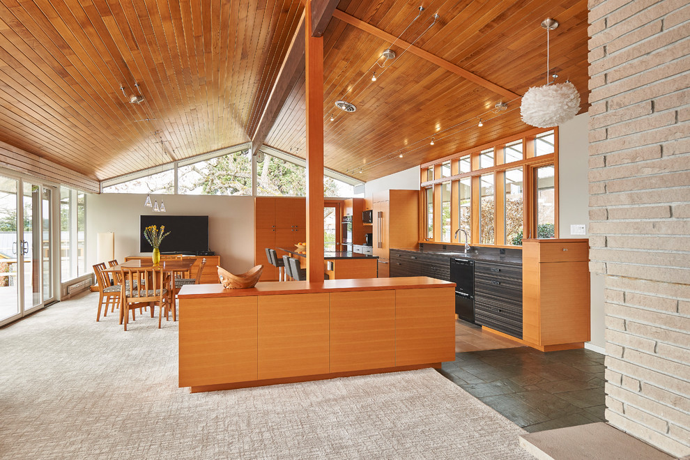 Photo of a large retro open plan dining room in Seattle.