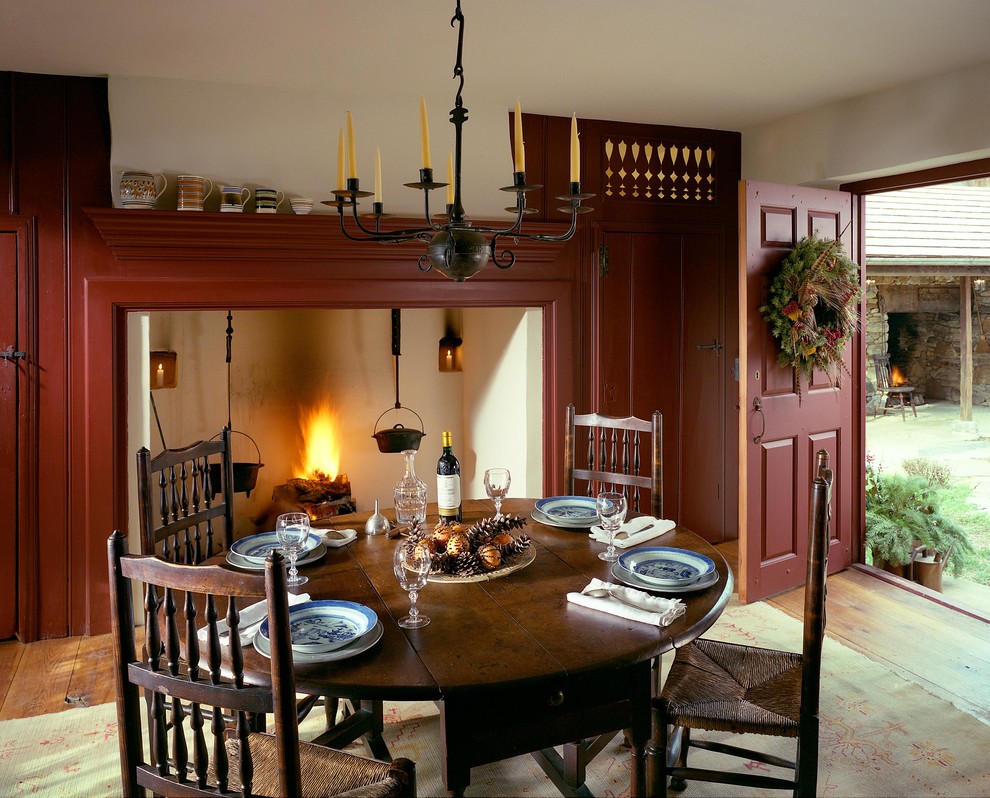This is an example of a country dining room in Philadelphia with white walls.