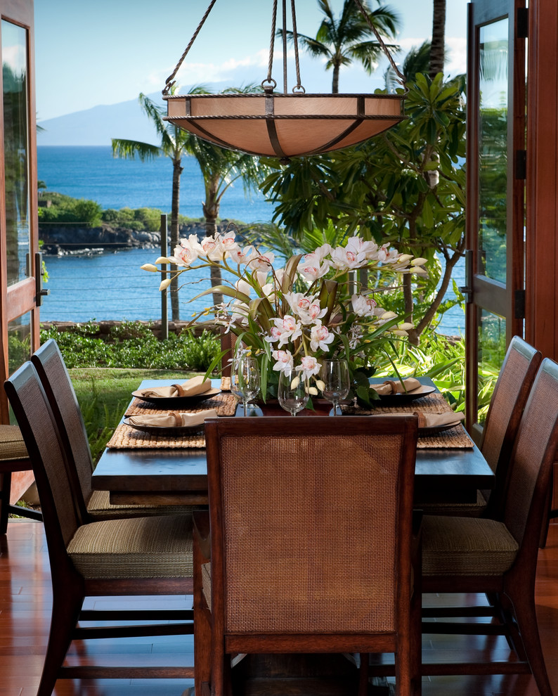 Example of an island style dining room design in Hawaii