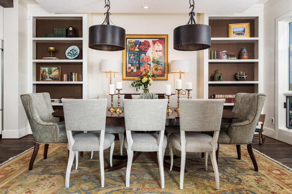 This is an example of a medium sized traditional dining room in Other with white walls, medium hardwood flooring, no fireplace, brown floors and feature lighting.