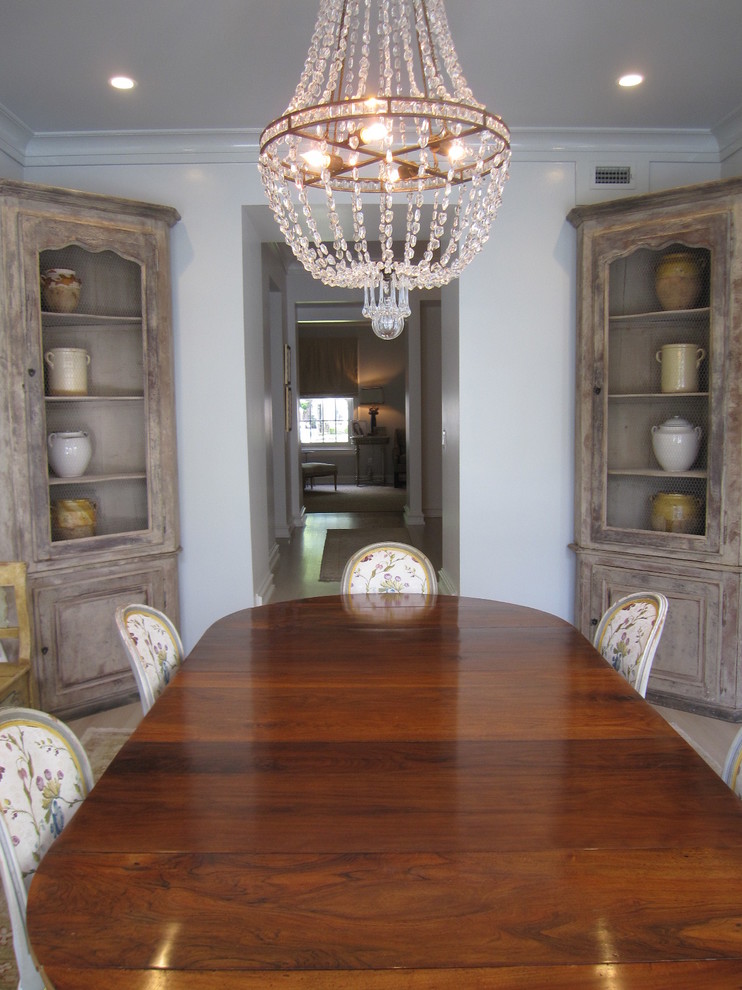 Enclosed dining room - small traditional light wood floor enclosed dining room idea in Houston with blue walls