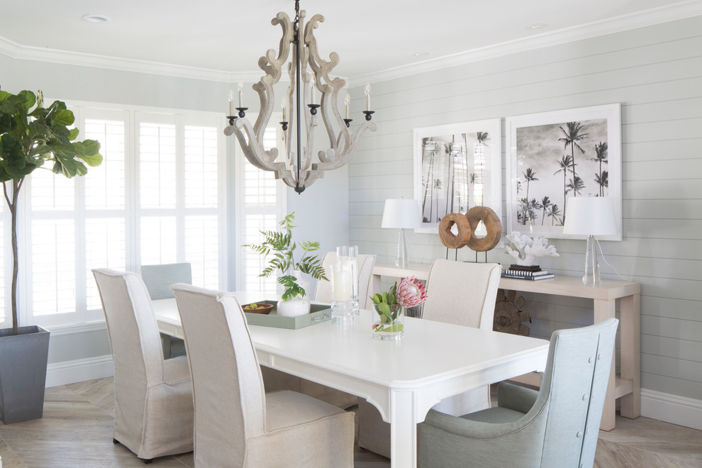 Photo of a nautical dining room in Miami with grey walls, no fireplace, beige floors and feature lighting.