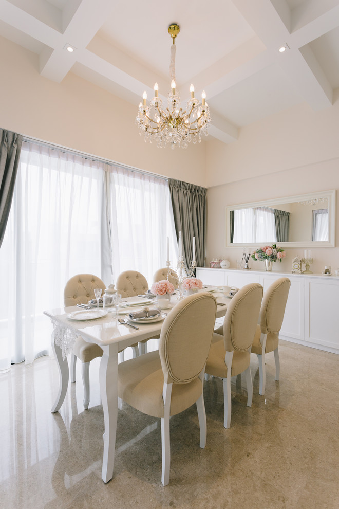 Photo of a medium sized victorian dining room in Singapore with white walls.