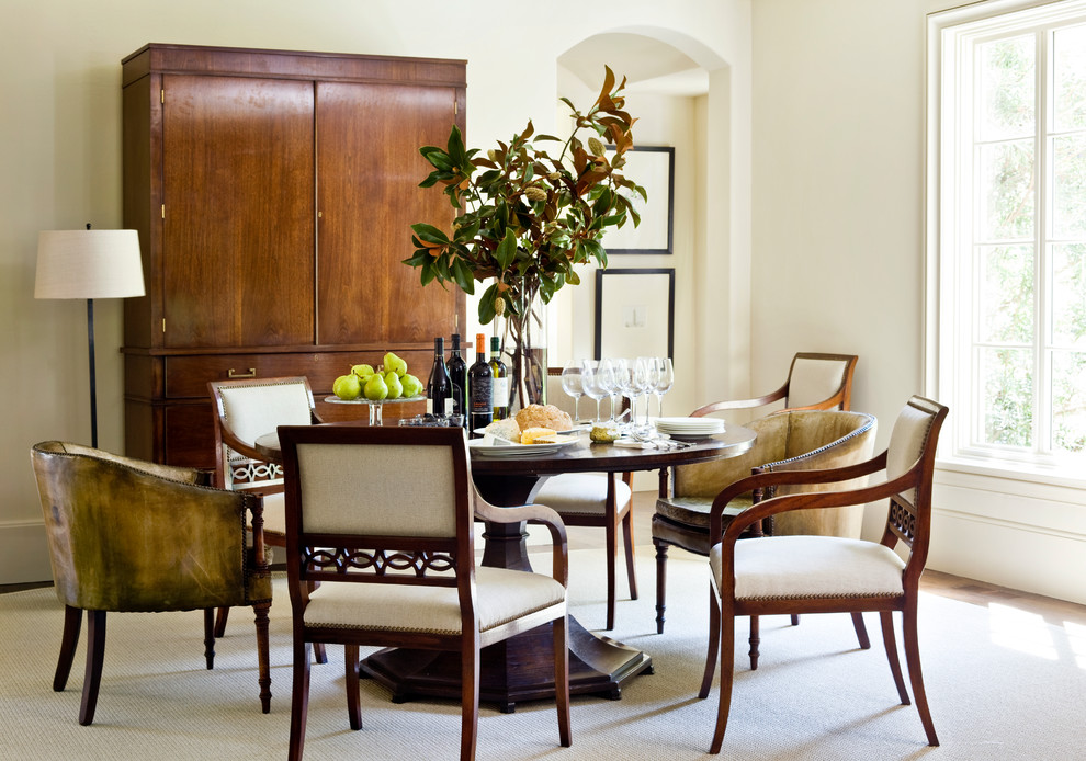 Example of a transitional dining room design in Atlanta with white walls