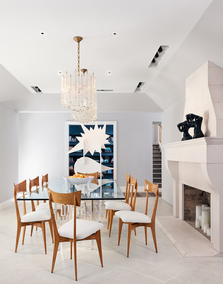 Design ideas for a contemporary dining room in Dallas with white walls and a standard fireplace.