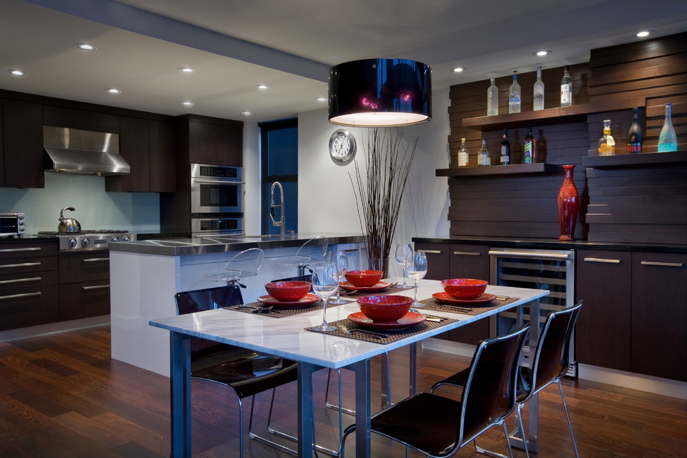Example of a mid-sized trendy dark wood floor kitchen/dining room combo design in Vancouver with white walls