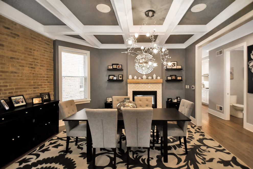 Dining room - mid-sized transitional dark wood floor, brown floor and coffered ceiling dining room idea in Chicago with gray walls, a two-sided fireplace and a tile fireplace