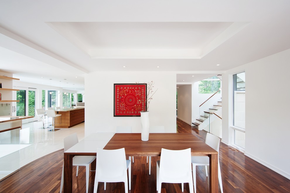 This is an example of a contemporary open plan dining room in Ottawa.