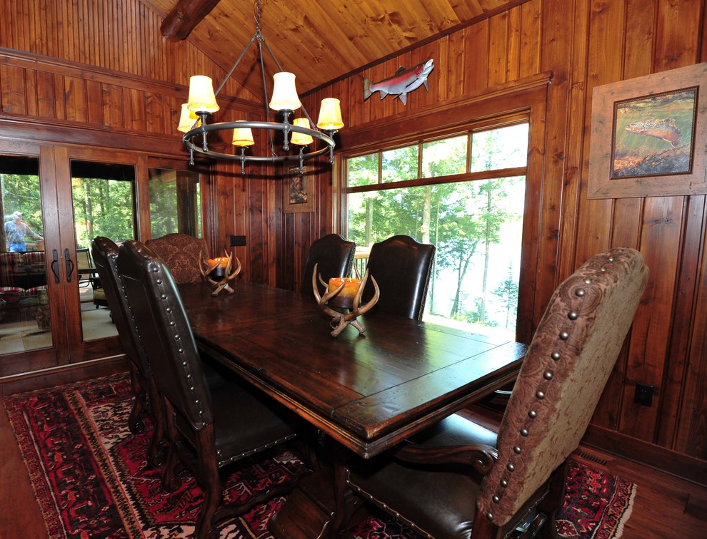 Inspiration for a medium sized rustic enclosed dining room in Minneapolis with brown walls, medium hardwood flooring, no fireplace and brown floors.