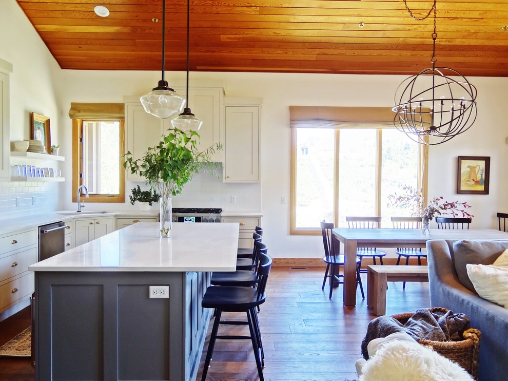 Inspiration for a medium sized farmhouse kitchen/dining room in Salt Lake City with white walls, medium hardwood flooring, no fireplace and brown floors.