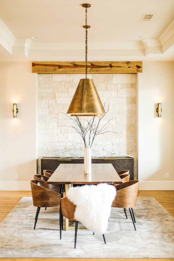 This is an example of a large contemporary dining room in Dallas with white walls and light hardwood flooring.