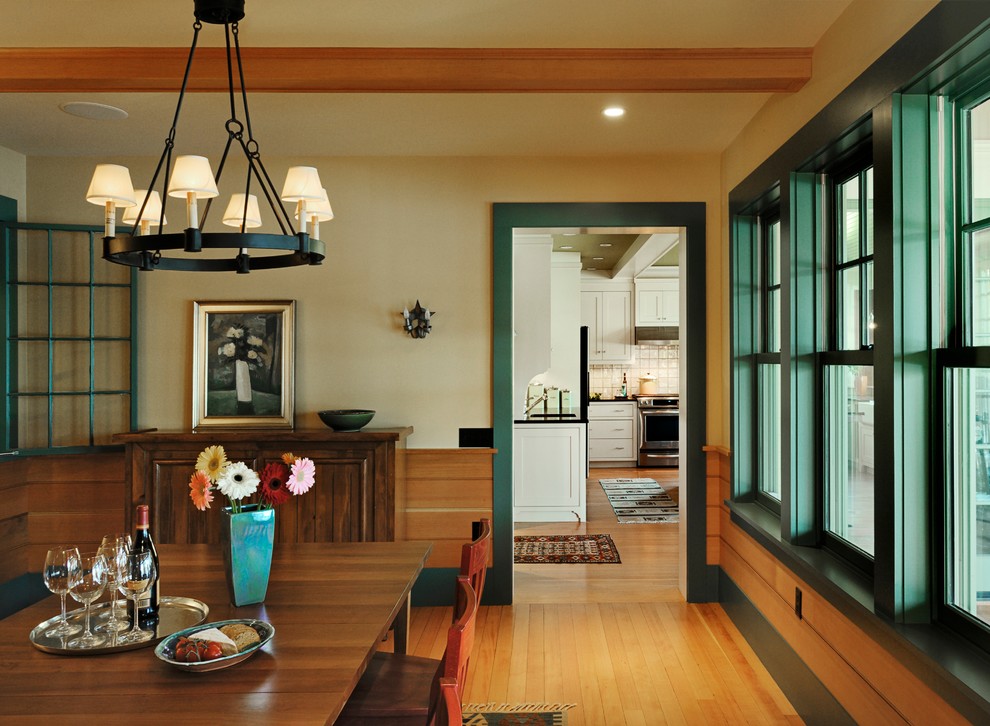 Photo of a rustic dining room in Burlington with beige walls and medium hardwood flooring.