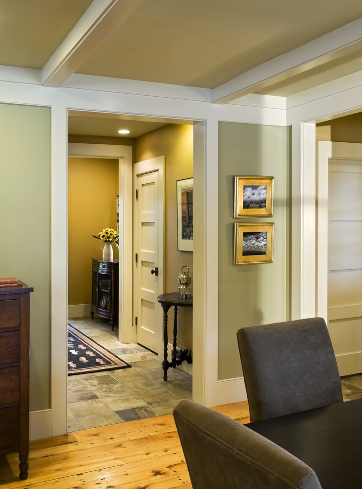 Inspiration for a rustic dining room remodel in Burlington with green walls