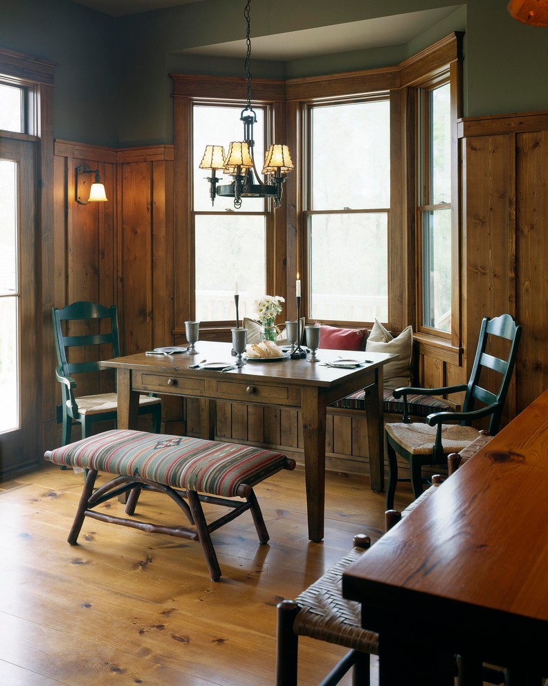 Example of a mountain style dining room design in Omaha