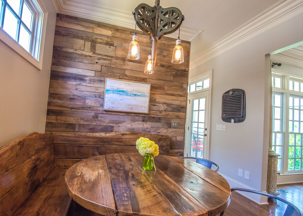 Example of a mountain style medium tone wood floor kitchen/dining room combo design in Nashville with gray walls