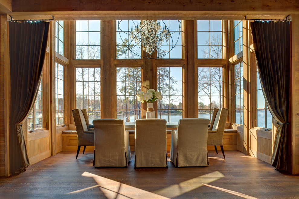 Large rustic open plan dining room in Charlotte with brown walls and medium hardwood flooring.