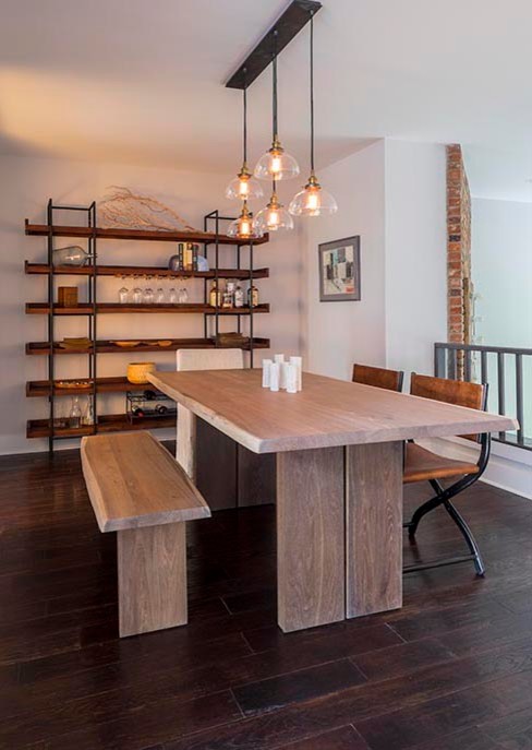 This is an example of a medium sized rustic dining room in New York with grey walls and dark hardwood flooring.