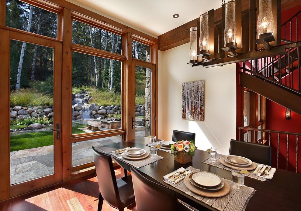 Example of a mountain style dining room design in Dallas