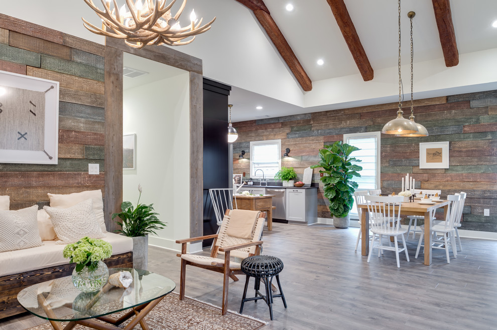 Great room - mid-sized transitional medium tone wood floor and gray floor great room idea in Atlanta with brown walls, a standard fireplace and a metal fireplace