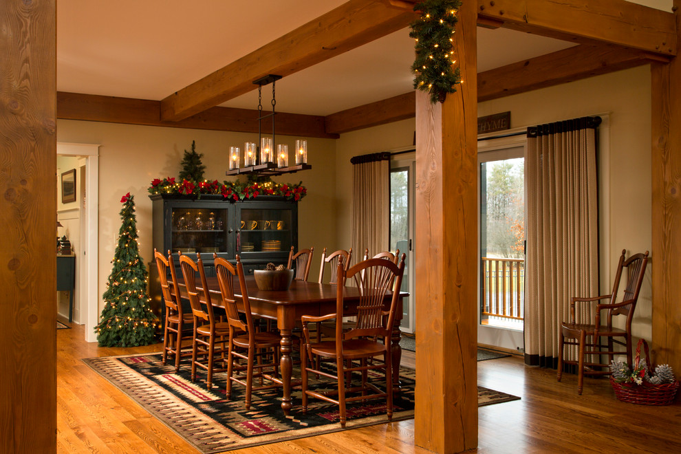 Inspiration for a traditional dining room in Boston with beige walls and dark hardwood flooring.