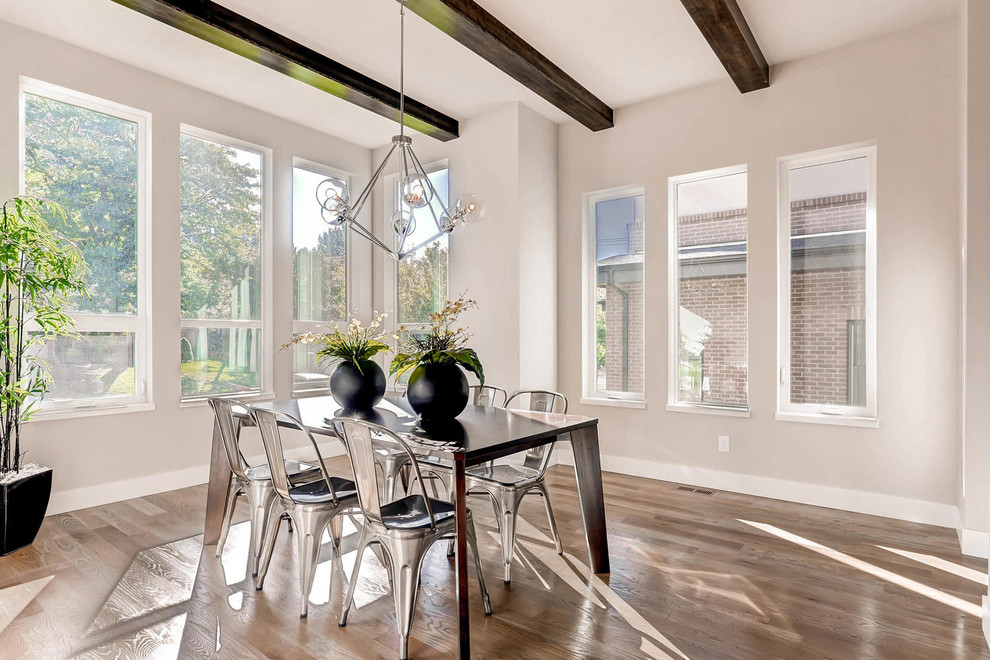 Inspiration for a classic enclosed dining room in Denver with grey walls, medium hardwood flooring and brown floors.