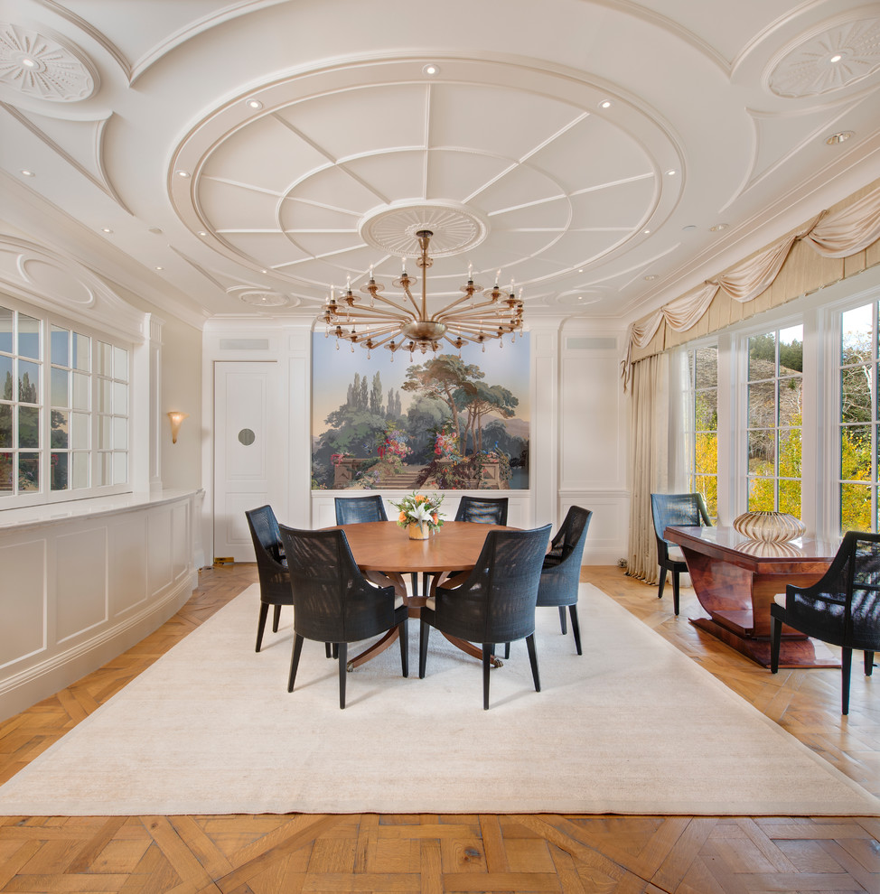 This is an example of a classic enclosed dining room in Other with medium hardwood flooring and beige walls.