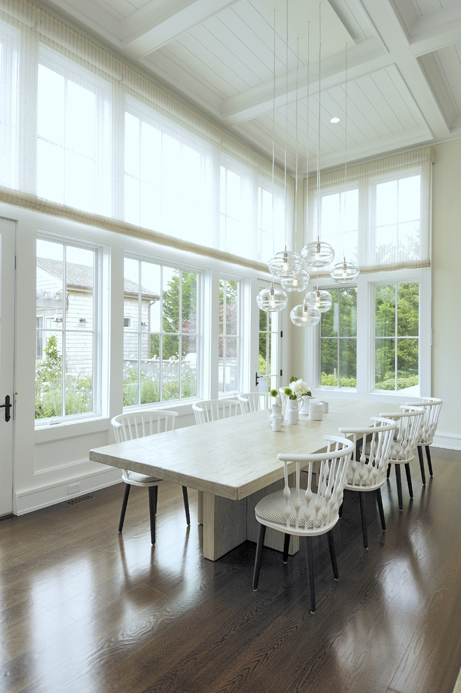 Inspiration for a classic dining room in Los Angeles with beige walls and dark hardwood flooring.