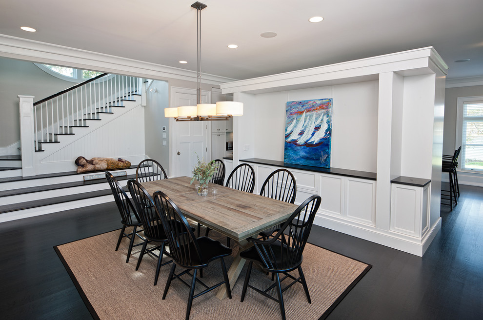 Inspiration for a beach style dining room in Richmond with white walls, dark hardwood flooring and brown floors.