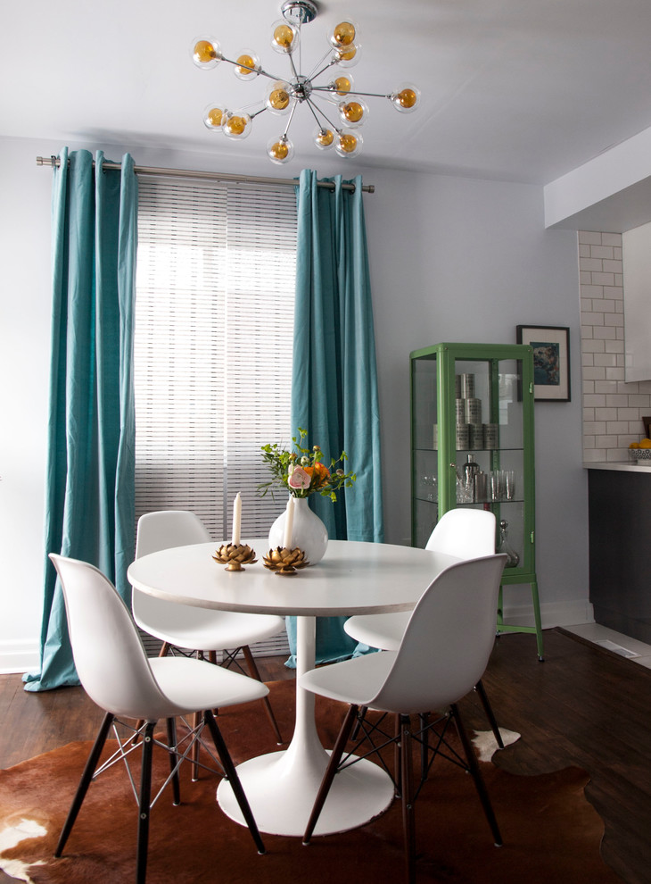 Esempio di una sala da pranzo aperta verso il soggiorno minimal con pareti bianche