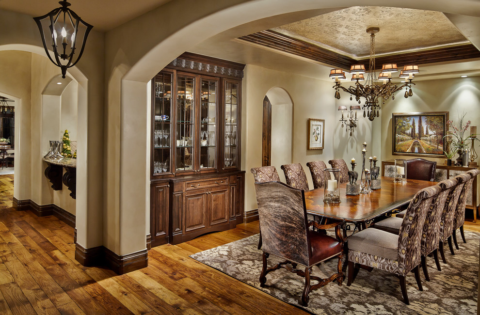 Tuscan medium tone wood floor kitchen/dining room combo photo in Denver with beige walls and no fireplace