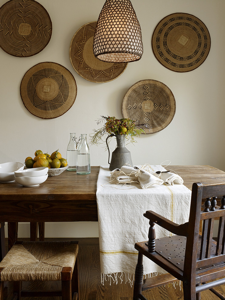 Dining room - rustic dark wood floor dining room idea in San Francisco with white walls