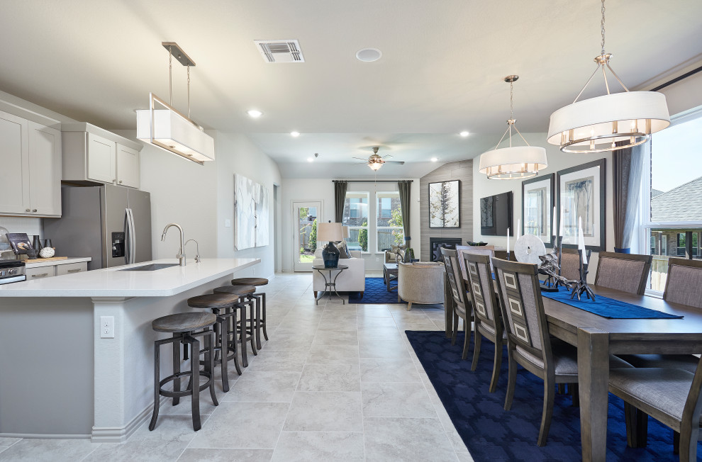 Ispirazione per una sala da pranzo aperta verso la cucina design di medie dimensioni con pareti bianche, pavimento con piastrelle in ceramica e pavimento beige