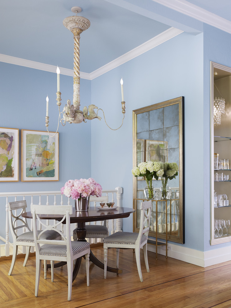 Example of a mid-sized cottage chic medium tone wood floor dining room design in San Francisco with blue walls