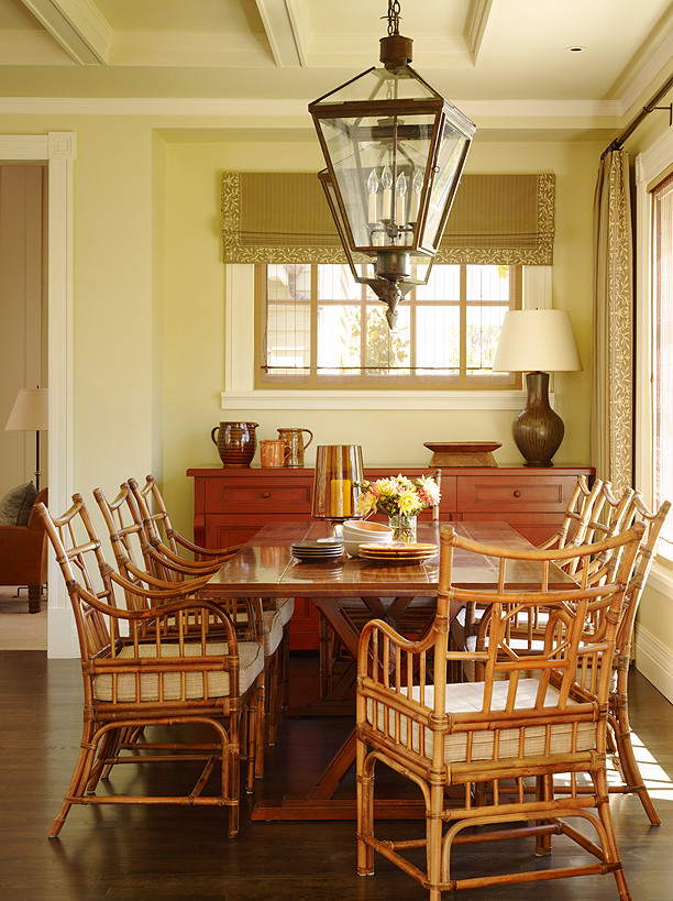 Medium sized traditional open plan dining room in San Francisco with brown walls, dark hardwood flooring and feature lighting.