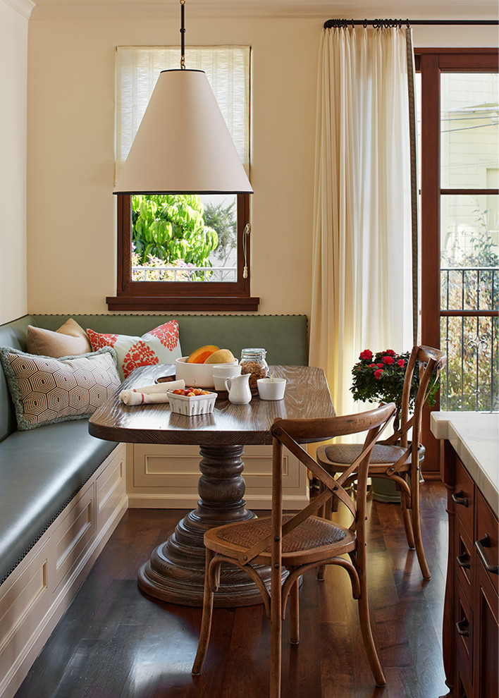 Small elegant dark wood floor kitchen/dining room combo photo in San Francisco with beige walls