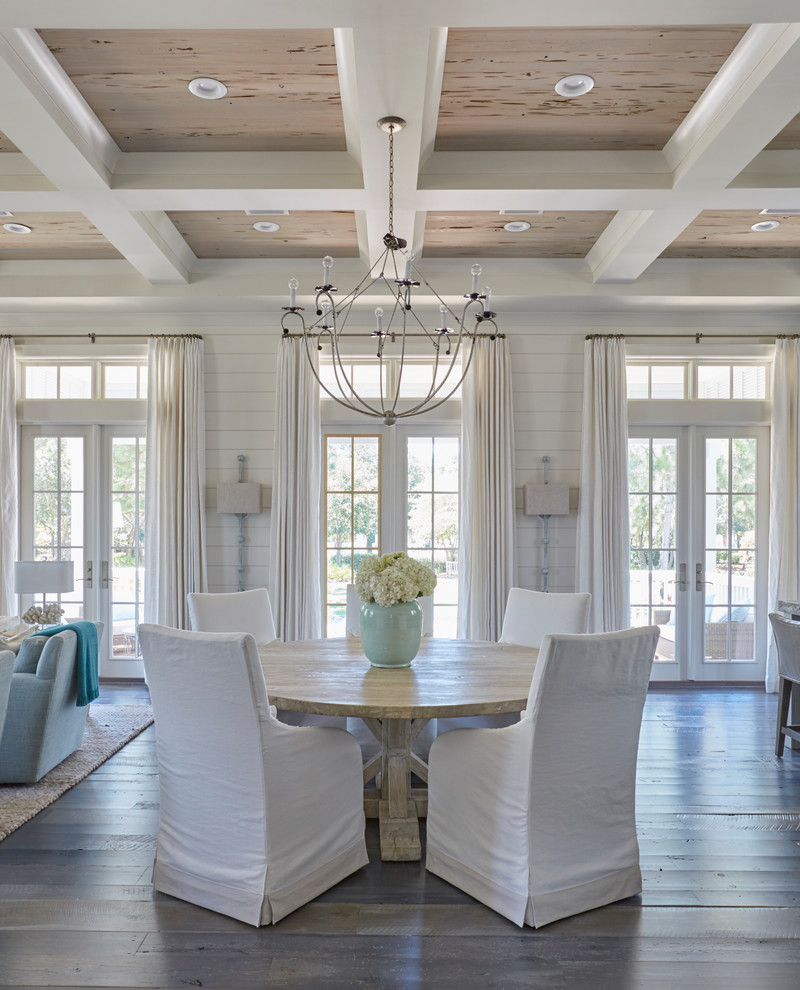 Dining room - coastal dark wood floor dining room idea in Miami with white walls and no fireplace
