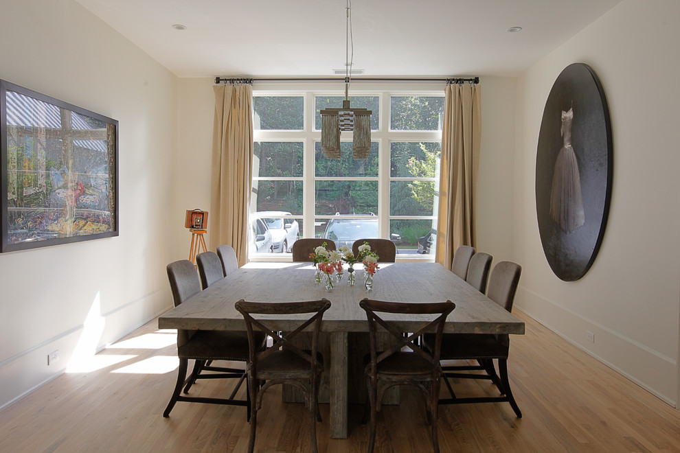 This is an example of a contemporary enclosed dining room in Atlanta.