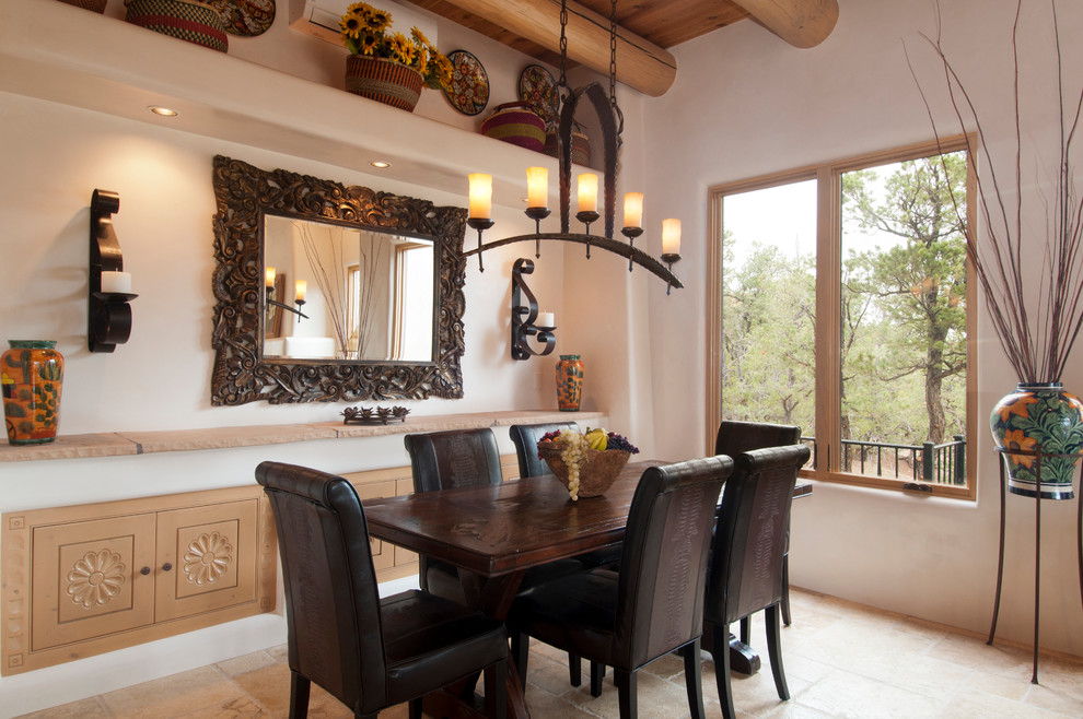 Design ideas for a medium sized open plan dining room in Albuquerque with beige walls and travertine flooring.