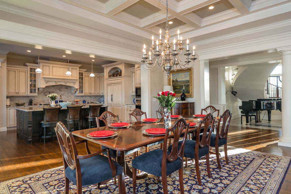 Classic kitchen/dining room in Miami with grey walls and dark hardwood flooring.