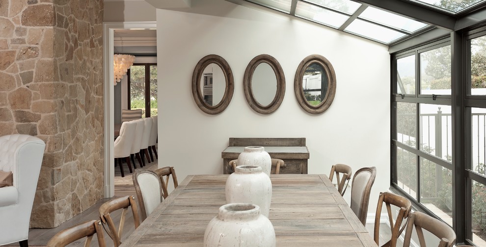 Trendy dining room photo in Orange County with white walls