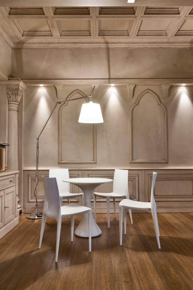 Mid-sized trendy medium tone wood floor dining room photo in Milan with white walls