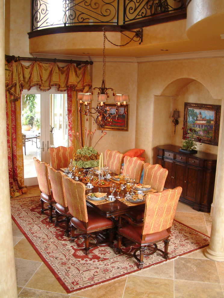 Inspiration for a large mediterranean ceramic tile kitchen/dining room combo remodel in Miami with beige walls and no fireplace
