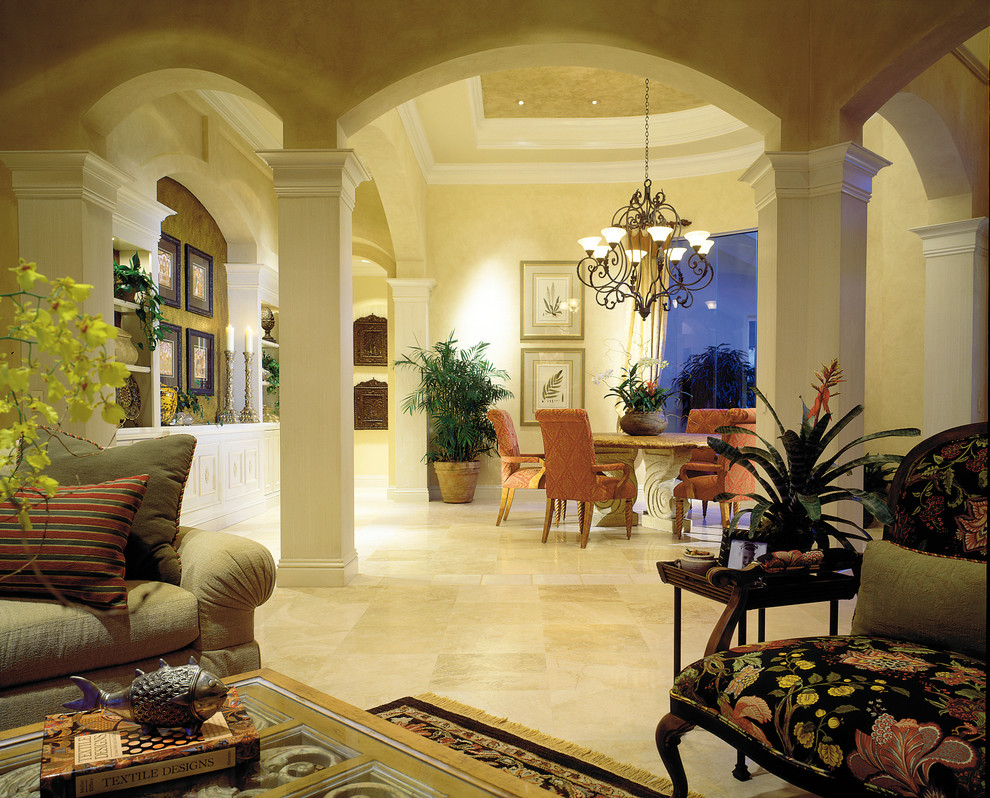 Photo of a large mediterranean enclosed dining room in Miami with beige walls, travertine flooring and no fireplace.
