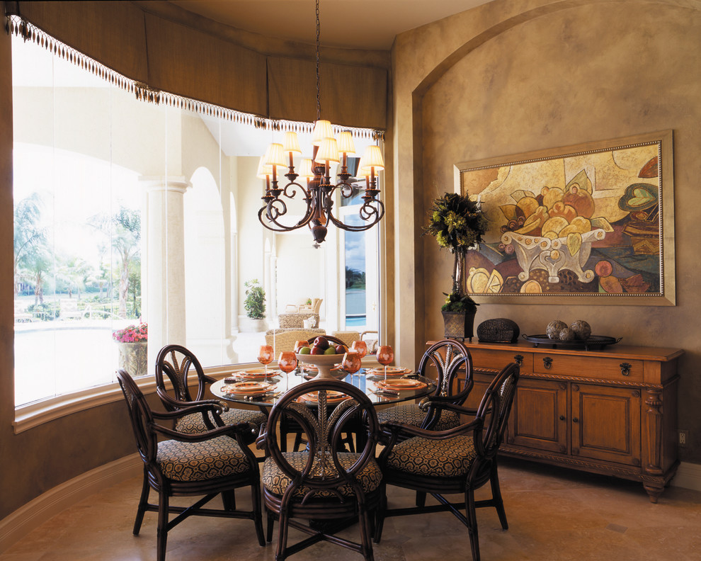 Medium sized mediterranean kitchen/dining room in Miami with beige walls, travertine flooring and no fireplace.