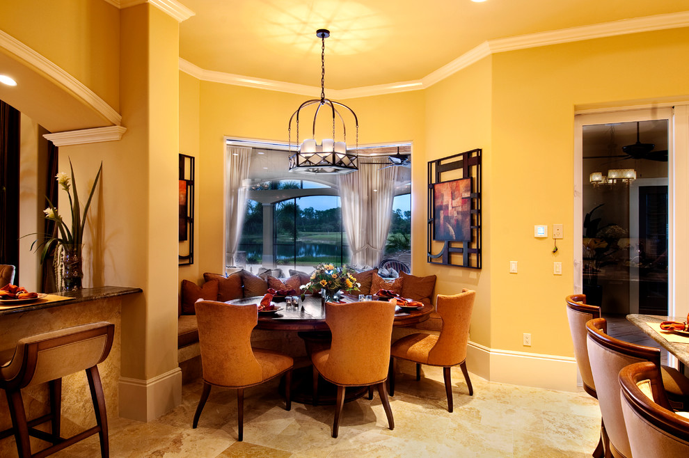 Great room - large mediterranean travertine floor great room idea in Miami with yellow walls and no fireplace