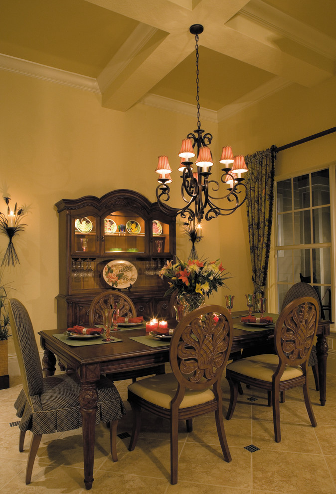 This is an example of a large country enclosed dining room in Miami with beige walls, ceramic flooring and no fireplace.
